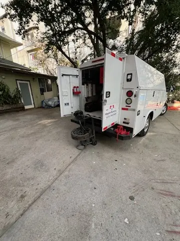 Magnet Plumbing service vehicle on-site for Grease Trap Cleaning in California